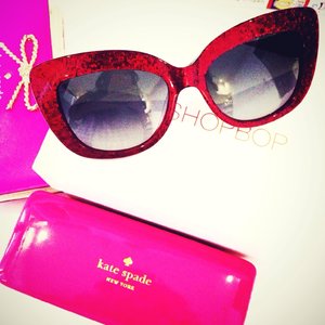 My new kate spade sunglasses from shopbop.com . Love the cat eye style and red glitters so much! I always think that red is the new black ;)