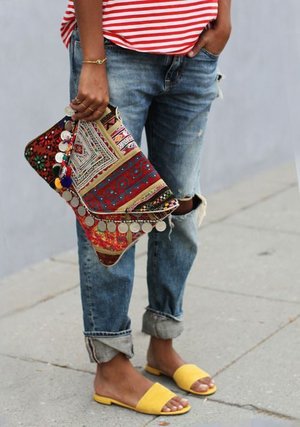 boho summer: hippie chic via the style files. striped tee, distressed jeans, batik clutch and yellow slippers.