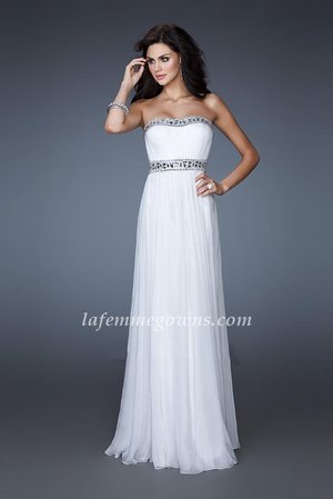  This Grecian inspired chiffon gown crafted in a poly chiffon fabric which falls softly from the waist down. The style is perfect for any shape, and is a very elongating and flattering fit. The embellishment detailing on the bust adds a touch of glamour and is sure to make you look and feel like a goddess at your next event. This is a gown for any sophisticated woman. Order your dress today.
 
Size: Standard Size or Custom Made Size
Closure: Back Zipper
Details: Gathered Bodice, Intricate Beading
Fabric: Chiffon 
Length: Floor Length
Neckline: Strapless
Waistline: Empire Waist
Color: White
Tag: White, Chiffon, Strapless, Long, Homecoming Dress, La Femme 18241