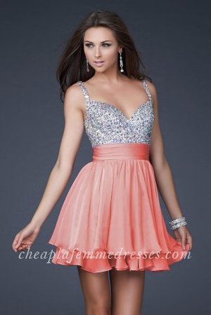 Show off those beautiful arms and shoulders in this stunning short beaded party dress by La Femme 16813. A beautiful sleeveless short semi formal dress featuring a shimmering beaded bodice with a sweetheart neckline. A wide band at the waist gathers the layered chiffon fabric that cascades down to create a flirty loose fitting layered A-line skirt. This dress is perfect as a Homecoming Dress, Cocktail Dress, Prom Dress, or a Special Occasion Dress.
 
Size: Standard Size or Custom Made Size
Closure: Side Zipper
Details: Layered Skirt, Embellished Top,Cup
Fabric: Chiffon, Sequin
Length: Short
Neckline: Sweetheart, Beaded Straps
Waistline: Natural
Color: Coral
Tag: Coral,Short,Beaded Straps,Layered,Homecoming Dresses,La Femme 16813 