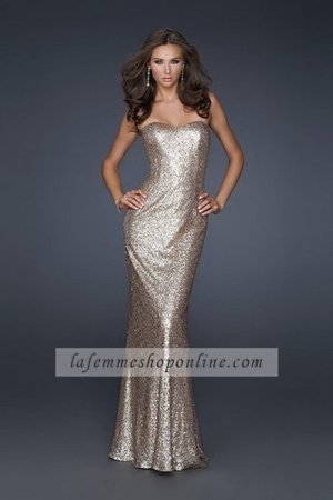 This unique and formal dress is fully sequined for a rich and luxurious look. The neckline is sweetheart and strapless. This sheath gown is form fitting and has a slim skirt. This is a long homecoming dress. The back is very low with criss-cross straps. Perfect for Homecoming, Prom, Cruise Wear, Pageants, Winter Formals, and Special Occasions.Size: Standard Size or Custom Made SizeClosure: ZipperDetails: Criss-Cross Straps, Fully Sequined, Mermaid SkirtLength: Floor LengthNeckline: Strapless SweetheartFabric: Chiffon, SequinWaistline: NaturalColor: NudeTag: Nude,Sequin,Mermaid,Strapless,Long,Homecoming Dress