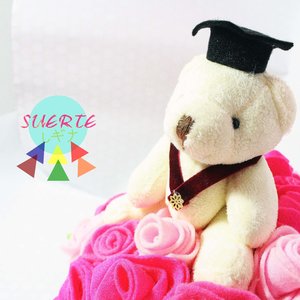 mini graduation doll in bouqet