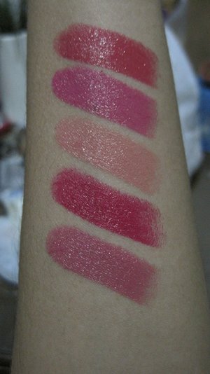 swatches of YSL Rouge Volupte lipsticks. Top to bottom: #34 Rose Asarine; #31 Fuchsia Tourbillon; #13 Peach Passion; #11 Rose Culte; #9 Pink Caress