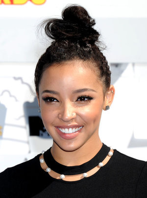 Tinashe. The top knot is super-cute and she has amazing skin, lips and brows... but the false lashes are effing with it all. I don't know if it's the lighting or what, but it's another case of one side looking longer than the other. |http://beautyeditor.ca/2015/04/14/mtv-movie-awards-2015|
