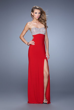 Showcase your alluring curves in La Femme 21200. This pleasing evening gown features a strapless and sweetheart neckline. The fitted bodice is heavily embellished with brilliant multi-shaped beads. Split straps wind across the open back. Perfect for 2015 Prom Dress, Homecoming Dress, Holiday Dress, Winter Formal Dress, or Special Occasion Dress. Size: Standard Size or Custom Made SizeClosure: Back ZipperDetails: Beaded Top, Open Back, Side SlitFabric: JerseyLength: LongNeckline: Strapless SweetheartWaistline: NaturalColor: RedTag: Red, Long, Strapless, Side Slit, Prom Dresses, La Femme 21200