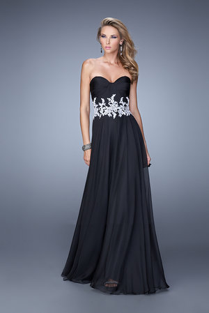 Take his breath away in La Femme 21285. This magnificent evening gown features a strapless neckline. Ruched chiffon drapes down the fitted bodice, and secured with a lavish lace in contrasting tone that wraps the midriff. Elegantly flowing, this floor length dress boasts a natural waistline. Perfect for 2015 Prom Dress, Holiday Dress, Winter Formal Dress, or Special Occasion Dress. Size: Standard Size or Custom Made SizeClosure: Back ZipperDetails: Lace Waist BandFabric: ChiffonLength: LongNeckline: Strapless SweetheartWaistline: NaturalColor: Black/WhiteTag: Black/White, Long, Strapless Sweetheart, Prom Dresses, La Femme 21285