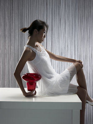 Behind the scenes: Testing out the effect of white chiffon dress and backdrop to feature a designer red vase