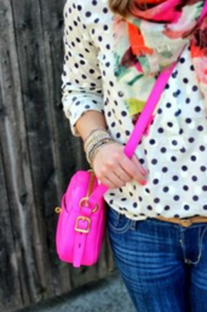 Polka dot shirt, colourful scarf and bright pink shoulder bag