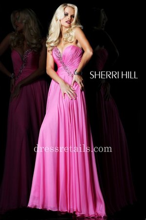 Prom Dress by Sherri Hill 1548. Classic flattering silhouette. Strapless, sweetheart bodice with a sheer notch and beaded embellishments. The full A-line chiffon skirt is floor length.Style: SH-1548Details: Faux Wrap Bodice, Beaded DetailsLength: Floor LengthNeckline: Sweetheart, StraplessWaistline: Drop