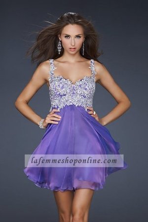 This dress has a neckline that is sweetheart with thick straps. The bodice is covered in lace with beaded details. The bedazzling of the top half of the dress is complemented perfectly with a baby doll bottom half. You will be the envy of all your friends if you work the room the right way.

Size: Standard Size or Custom Made Size
Closure: Center Back Zipper
Details: Embellished Bodice, Hand-Painted, Cups
Fabric: Poly Chiffon
Length: Short
Neckline: Two Strap
Waistline: Natural
Color: Light Purple
Tag: Light Purple,Short,Two Strap,A-Line,Homecoming Dresses