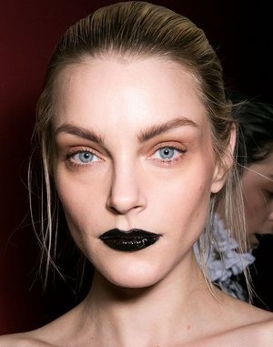 Black lips will give you a strong look. 