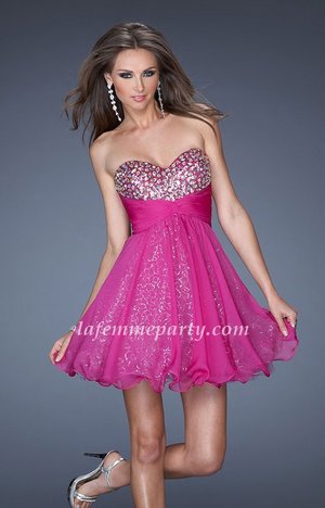 La Femme Style 19250 Short Prom Dress Features a Sweetheart Neckline, Silver Stone Embellished Bodice, Ruched Waistline, Sequined Underlay and Chiffon Overlay Short Skirt. This La Femme Short Dress is perfect for Prom Dress, Cocktail Dress, Party Dress, Winter Formal Dress, Homecoming Dress or Special Occasion Dress.

Size: Standard Size or Custom Made Size
Closure: Back Zipper
Details: Sequins, Ruching, Stone Accents on Bust
Fabric: Chiffon
Length: Short
Neckline: Strapless Sweetheart
Waistline: Empire
Color: Magenta
Tag: Magenta, Short, Strapless, Prom Dresses,La Femme 19250