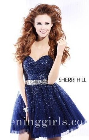 Prom Dresses by Sherri Hill, designer gown style 2787. This cocktail dress is perfect any special occasion! The neckline is sweetheart, strapless and has a flattering fit. The bodice is fully sequined and the waistline is natural and embellished with large jewels. The short skirt is fully in tulle with sequins. The back is mid with a back zipper. This style is shown in Fuchsia (sold out), White, Nude, Pink, Navy / Gunmetal (sold out), and Blue. Worn by Fifth Harmony on Fox's X Factor TV Show! TJ Formal is an authorized retailer of Sherri Hill dresses. Shop with confidence knowing you will receive a authentic designer gown by Sherri Hill!