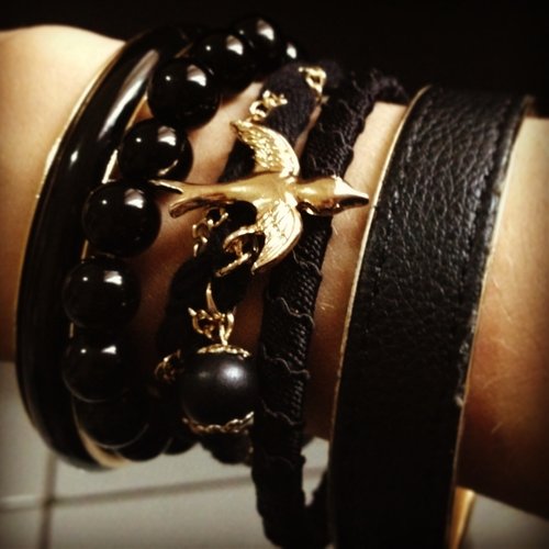 Black arm candy to brighten up black outfit