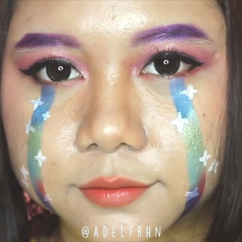 Crying Rainbow / Rainbow Tears Makeup Tutoral 🌈Inspired by @janineintansari 🌸Deets 🐾· @maybelline Baby Skin Pore Eraser· @youmakeups_id Full Coverage Liquid Foundation· @maybelline Instant Age Rewind Eraser Dark Circle· @fanbocosmetics Acne Solution Loose Powder· @beautyglazed Gorgeous Me· @holikaholika_indonesia Eye Spanglitter Color· @youmakeups_id Longlasting Ultra Waterproof Eyeliner· @catrice.cosmetics The Little Black One Mascara· @youmakeups_id Dual Extra Volume Mascara (only using the Fiber)· @eminacosmetics Cheeklit· @officialsnazaroo Sparkle Face Paint· @missha.official Wish Stone Tint Velvet#adelescence #grwdels @cchannel_beauty_id #cchannelbeautyid @cchannel_id #cchannelid #cchannelfellas @hyouyaa @ravenzii @kimuhazyo