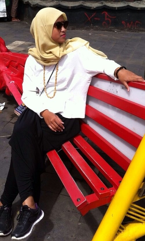 This is me. Wearing a simple yellow hijab, white tshirt, black pants, sport shoes and some accessories really show my personality  #ClozetteID #GoDiscover #ItsSoYou #HijabStyle