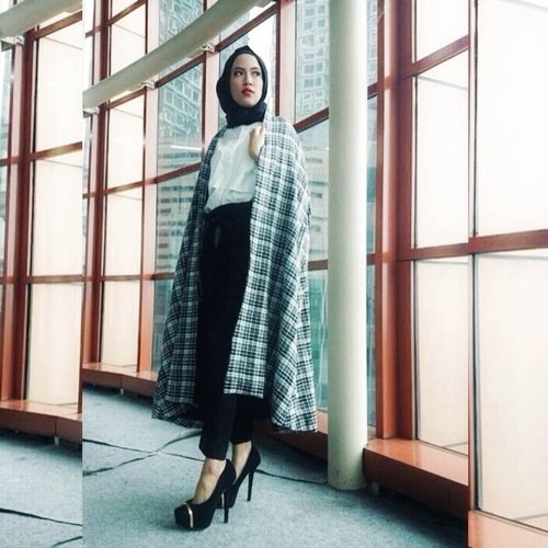 A basic black and white with the tocu of plaid cape
