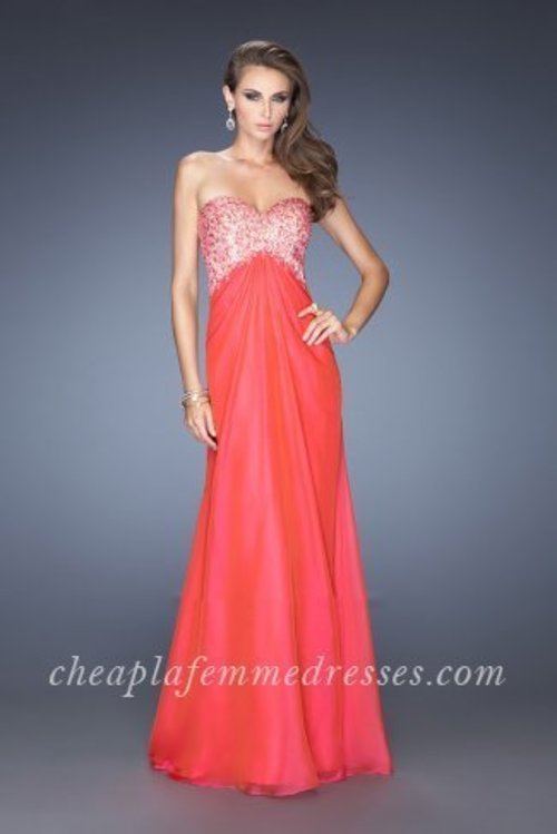 Captivating chiffon La Femme 20169 gown with a sweetheart neckline and gathered skirt. The bodice has a nude lining and colored net overlay adorned with matching beads and iridescent jewels. Back is open with two sheer straps going across horizontally. This dress is perfect as a Homecoming Dress, Wedding Guest Dress, Prom Dress, or a Special Occasion Dress. Size: Standard Size or Custom Made SizeClosure: Back ZipperDetails: Beaded Bodice, Open BackFabric: ChiffonLength: LongNeckline: Strapless Sweetheart Waistline: NaturalColor: CherryTag: Cherry,Strapless,Long,Open Back,Prom Dresses,La Femme 20169