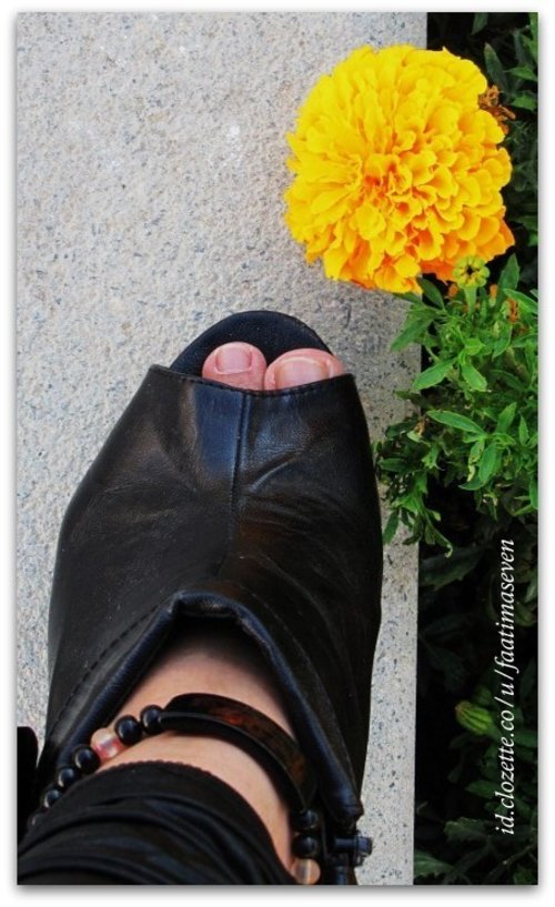 Actually at the time I was waiting for a concert of a music band in Konya city, Turkey. As a private photographer of them I had to ready for their moments. Along they were doing  the sound check on the stage, I walked around at the yard and fell 'click' with the yellow flower when it met my shoes. Then here they were. :)