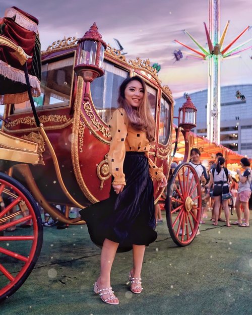 Carnival Mood 🎡🎢🎪🎠
.
.
.
The little girl behind the carriage tells all 😊👍🏻 Could relate to her on a very deep level 😂
—
Mustard Blouse from @standforwoman 
Black Pleat Skirt from @macadamiahouse 
Studded Nude Heels from @eliev.id —
#PriStyleDiaries
#ThePetiteMissyTravels
📸 @evelynegabriella .
.
.
.
.
.
.
.
.
.
#whatiwore #vintage #dreamy #castle #parisian #womensfashion #fashionistas #travelblogger #ootdinspiration #lotd #fashionblog #bloggerstyle #fashion #wiwt #styleinspo #instastyle #blogger #ootdfashion #ootd #styleblogger #blogger #fashionblogger #fashioninfluencer #singapore #singaporeblogger #style #outfit #outfitoftheday #clozetteid