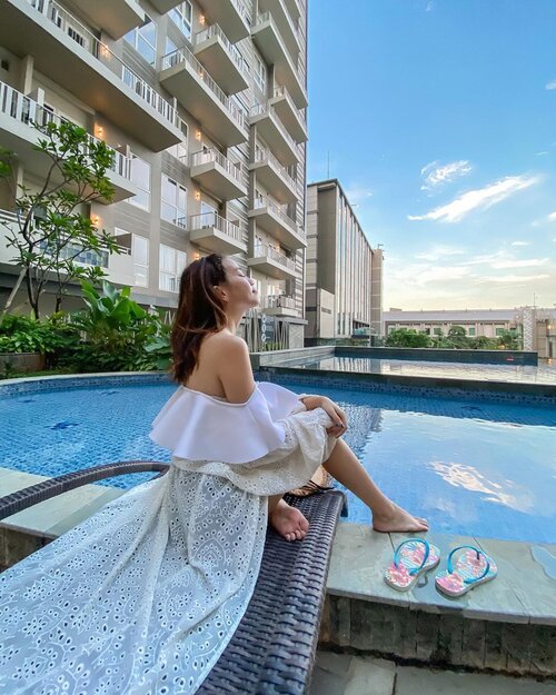 May your day be bright and jolly today🤍 Guess if the sky is real or edited? .....#staycation #throwback #shotoniphone #style #clozetteid #pool #explore #swim #exploretocreate #love #zalorastyleedit