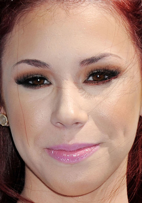 Jillian Rose Reed got a jarring contrast between the warm (and too heavy) brown eyeshadow and the cool-toned pink lips. And the false lashes are too much.
