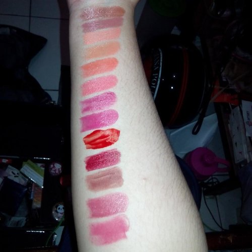 My lip cosmetics collection swatches. Most of them are drugstore brands. Now that i see my whole lipstick collection i realize that most of them have bright colors and cream or gloss formulation (i hate dry lips). You'll rarely see a nude, matte, or toned down colors here (nude lips for me similar with no lipstick or pale, only work when i have a really dark smokey eyes). I change my lip colors everyday because i get bored easily. I even mixed a few lipstick together to create a new color. Personally i won't buy a lipstick color if i can still mix it with other lipstick, foundation, or eyeshadow to create a new color. Why should i spent more money if i can still be smart about it. But lately, i've been tempted to buy a dark, matte, nude lipstick to add to my gradation collections. Well, a girl can't have too many lipstick right?😜😜 #selfjustification #makeup #lipsticks #lipstickswatches #lipcollections #agirlcanthavetoomanylipstick #lipstickmafia #lipaddict #bandungbeautyblogger #bandungmua #munetee #lipsticklover #brightlips #clozetteid #makeoverid #maybellineid #sariayu