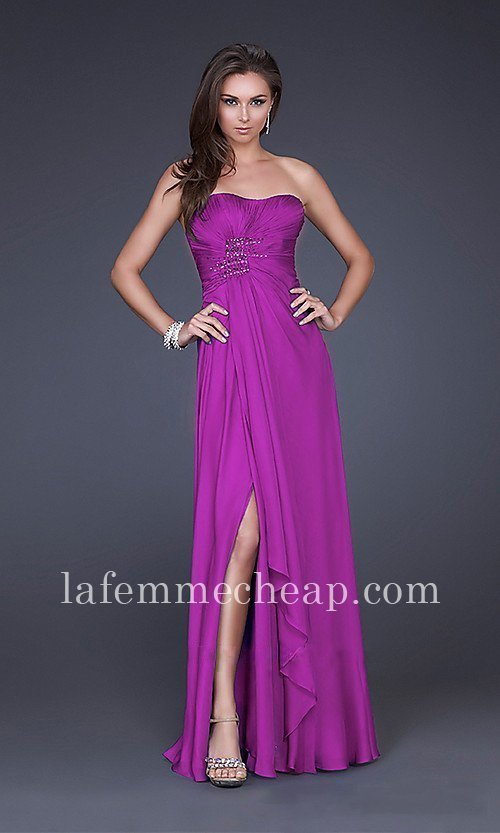 For a woman that always puts elegance first, this La Femme 15978 is perfect for you. With a strapless neckline that features a delicately draped upper bodice, this is sure to turn heads at any event. Jewel embellishments are also placed at the front and back gathered part of the dress, giving it a fitted silhouette while the floor length skirt with slit gives sophistication.  Size: Standard Size or Custom Made SizeClosure: Side ZipperDetails:  Sparkling Accents, Ruche Bodice, Front SlitFabric: ChiffonLength: Full LengthNeckline: Straight, StraplessWaistline: Empire Color: MagentaTag: Magenta, Strapless, Long, Evening Dresses, La Femme 15978