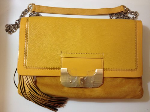 Bought this Harper Envelope bag like 3 weeks ago and I got compliments whenever I use it. Love the mustard yellow color! The photo does not do justice! 
