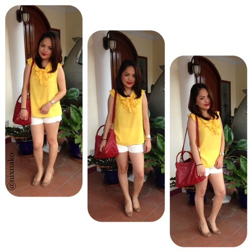 Bright yellow top & shorts with red bag