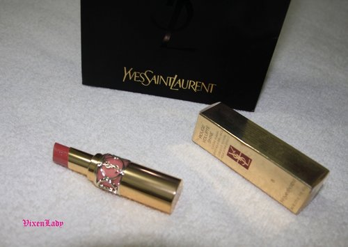 Yves Saint Laurent Rouge Volupte Shine #8 Pink in Confidence. A medium pale pink lipstick with warm brownish undertone and slight shimmer in it. The texture is wonderful, creamy and glides on easily. Just like the name, it shiny, and stay shiny. Truly gorgeous product.