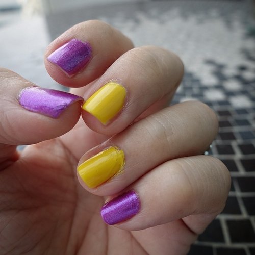 My gal told me that colors on the opposite sides of the color wheel works well together so I decided to give violet and yellow a go! #Clozette #clozetteid #nails