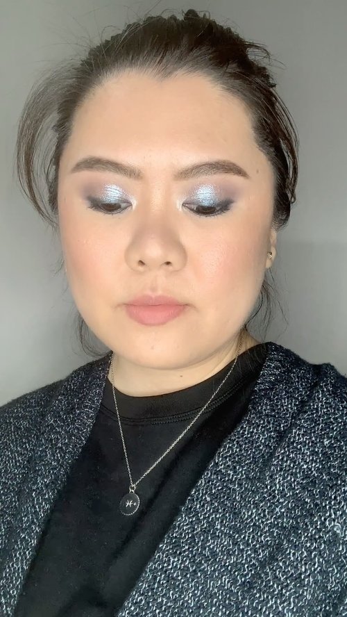 Fun sparkly makeup look for NYE 🥳 I created this look to match my silver zodiac necklace from @love.luaesol . Haven’t done much cool toned makeup so this was fun to do! Products used:Moisturizer - @tatcha water cream.Foundation - @makeupforever reboot foundation.Concealer - @tartecosmetics shape tape concealer.Brows - @glossier brow flick & ABH brow wiz.Eye primer - @fentybeauty primer.Eyes - @marcjacobsbeauty steeletto palette.Lashes - @covergirl lash blast mascara.Contour - @smashboxcanada contour palette.Blush - @marcjacobsbeauty air soft blush.Highlighter - @beccacosmetics champagne pop.Lips - @lisaeldridgemakeup velvet fawn.Necklace - @love.luaesol Pisces Minimalist Zodiac necklace.