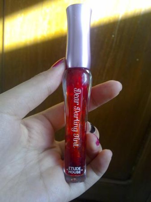 A red-orange Etude Dear Darling tint. I usually use this to make a color gradation along with my oriflame clover lipstick.