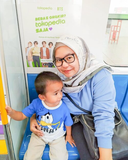 Rio's first MRT trip (with BTS!) 🤣🤣🤣 Jadi salah satu agenda birthday trip beberapa weekend yang lalu adalah untuk mengajak Rio naik MRT. Karen tempat nginep cukup dekat dengan MRT Fatmawati, makanya langsung cus naik. Pokoknya biar Rio ngerasain bagian jalur kereta di atas dan juga di bawah tanah. .Enaknya naik MRT, keretanya datang setiap 10 menit dan ontime (so far). Pas kita naik, kita hanya nunggu sekitar 5 menit dan EH KEBETULAN DAPET KERETA #TOKOPEDIAXBTS DONG. Ini sih yang seneng Ibunya HAHAHAHA. Anaknya suka BTS juga sih. Swipe swipe buat Rio ngefanchant kalau ga percayaaaa hahahahaha. Seneng juga dia foto bareng gambar BTS 🤣🤣 .Anw keretanya ga terlalu ramai sih dan Rio alhamdulillah cukup kondusif, alias mau duduk santuy sendiri di kursi & ga berdiri-berdiri. He was pretty much happy to ride  on the MRT train. Ibunya happy karena bisa turun di stasiun MRT Bunderan HI dan foto sama BTS (pic coming soon) 🤣🤣🤣. Bapaknya happy karena anak dan istrinya happy (dan ga terlalu capek wkwk). Lengkap ❤️ .--------.#satrio36mo #satriorpradana #jalanjalan #staycation #weekendtrip #birthdayweekend #birthdaytrip #mrt #mrtjakarta #mrttokopediaxbts #toddlertravel #travelingwithtoddler #jakarta #visitjakarta #bangtan #bangtansonyeondan #reviewibuFaradila #clozetteid #clozettedaily #momblogger #lifestyleblogger #bloggerperempuan #femalebloggersid