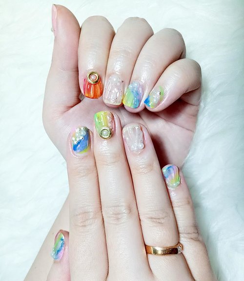 My Mermaid inspired nail art by @menail.salon 😻, with bright colors, pearls and tiny seashells accessories - they are so ready for a beachy holiday! 
Have your own dream nail designs?  Me-Nail can make it happen! Ask for @suliatiowatimahardi,  one their senior nailists if your design's complicated 😉

#nails #nailart #mermaid #mermaidlife #mermaidnails #mermaidinspired #mermaidinspirednails #gelnailart #colorful #seashells #pearls #notd #allaboutnails #nailjunkie #menail #clozetteid #clozettedaily #beautynesiamember #sbybeautyblogger #bloggerceria #endorse #openendorse #sponsored #endorsement #blogger #bblogger #bbloggerid #beautyblogger #indonesianblogger #surabayablogger