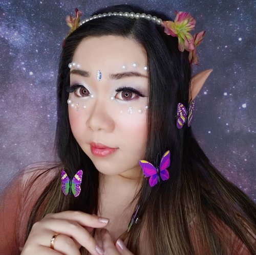 Details of my Light Fairy look.

The makeup is pretty simple (as usual 🤣) but this time it's because i want to focus on playing with decos. I use purple and pink shimmer shadows (because what is a light fairy if not a blob of shining shimmering glittery being right?) and a truckload of shimmery white eyeshadows (not even a highlighter but a pure white shimmer shadows) all over my cheeks and temples for that extra glow. The lips is just combination of frosty pink lipstick with soft pink lipstick and gloss (i love glosses but as we wear masks everywhere i can only use them at home for now 😢).

The inspo that i based my look on actually has tonnes of smaller pearls all over the cheek and eyebrow areas, but when the pearls that i ordered came... It's about 2-3 sizes bigger than i needed 🤣 so i had to modifiy by using them sparingly and add a little crystal in the middle.

For those who are asking, i used falsies glue to stuck them on and it works super well.

I am now addicted to playing with decos so please expect a lot more of these type of looks from me, i hope you'd enjoy them as much as i enjoy creating them!

PS : It's so hard to post lots of pics at IG now, it keeps on crashing so i had to edit this over and over again, please send me love to cheer me up okay!

#clozetteid #fairy #fairymakeup 
#lightfairy #fairylook #fairyinspired
#BeauteFemmeCommunity  #thematiclook #thematicmakeup 
#sbybeautyblogger #makeup #ilovemakeup #clozetteid #sbybeautyblogger #bloggerceria
#beautynesiamember #bloggerperempuan #indonesianfemalebloggers #girl #asian  #bblogger #bbloggerid #influencer #influencersurabaya #influencerindonesia #beautyinfluencer #surabayainfluencer #jakartabeautyblogger #SURABAYABEAUTYBLOGGER #makeuplook