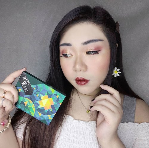 As I promised for quite a while now, review of @dazzleme.beauty.official
Eyeshadow palette in Star/Mystery is here. After using it multiple times, I'm finally making up my mind about it 😁.

Color palette wise, I personally find this variant the most attractive out of the 3 variants available, if you love warm colors with sunset vibes - this one is for you. Containing 12 shades, ranging from matte, shimmer to glitter, the  size is pretty small and compact. The palette is made of sturdy cardboard material, making it travel friendly.

Texture wise, I find a lot of the shades to be very buttery and smooth, some bit harder and chalkier than others. Pigmentation is medium, nothing too impressive but nothing to be frustrated about. Some are a bit weak (some of  the shimmer shades are very weak and that really shocks me as usually the shimmers are a lot more pigmented in most palettes, on the contrary most of the darker matte shades are very nice. The glitter shade, Enigma, is beautiful and pigmented, probably my fave out of the palette) so you would need to apply a lot, but this also means that the palette is beginner friendly. All of the shades are blendable and I didn't find any to be patchy.

To be completely honest with you, my feelings for the palette? Just fine. I'm not blown away or anything, and if I have to pay the full price of the palette then I probably wouldn't - but they do go on promo all the time, and when they do, I think it's worth a try. I actually already purchased a second palette, would you like me to do a review and swatches of the second one as well? Please let me know coz I'd love to do it you are keen!

#dazzleme #dazzlemepalette #eyeshadow #eyeshadowpalette
#reviewwithMindy #eyeshadowpalettereview #eyeshadowreview #chinesemakeup
#clozetteid 
#sbybeautyblogger
#bloggerindonesia #bloggerceria #beautynesiamember #influencer #beautyinfluencer #surabayablogger #SurabayaBeautyBlogger #bbloggerid #beautybloggerid #indobeautysquad  #girl #asian #endorsementid  #jakartabeautyblogger #openendorsement #endorsersby #endorsementid #startwithsbn #socobeautynetwork