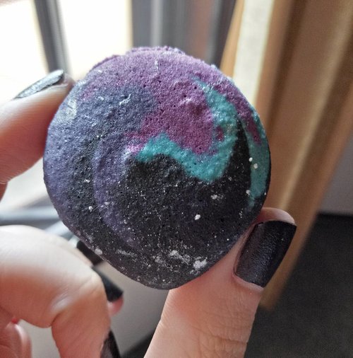 How pretty is this Galaxy Macaron from @bakerzinsby?  Like i always said,  i definitely eat with my eyes and am always drawn to beautiful/cute foods that i won't necessarily purchase if not for the beaut 😂, yes i am shallow liddat. 
I am not the biggest fan of sweets,  but i do love macarons-problem is we can't really find nice macarons locally-so i just stopped looking.  Until this Galaxy Macaron beckoned me and we came running.  I'm pleasantly surprised that Bakerzin's macarons are very nice! Not too sweet,  slightly crunchy with buttery fillings. 
Glad to say that this one's tastes as pretty as it looks 😝. It's not cheap,  IDR 13K for one tiny macarons (we got the set of 5 that costs 60K) but then again macarons are expensive in general anyway! 
#bakerzin #minireview #macarons #galaxymacarons #galaxydesign #yummy #sweet #dessert #confectionery #frenchmacaroons #culinary #instafood #instaworthy #instadessert #instamacaron #foodgasm #sweettreats #sweettooth #guiltypleasure #surabaya #bakerzinsurabaya #lifestyle #culinaryadventure #culinarysurabaya #clozetteid #clozettedaily #blogger #lifestyleblogger  #indonesianblogger #surabayablogger