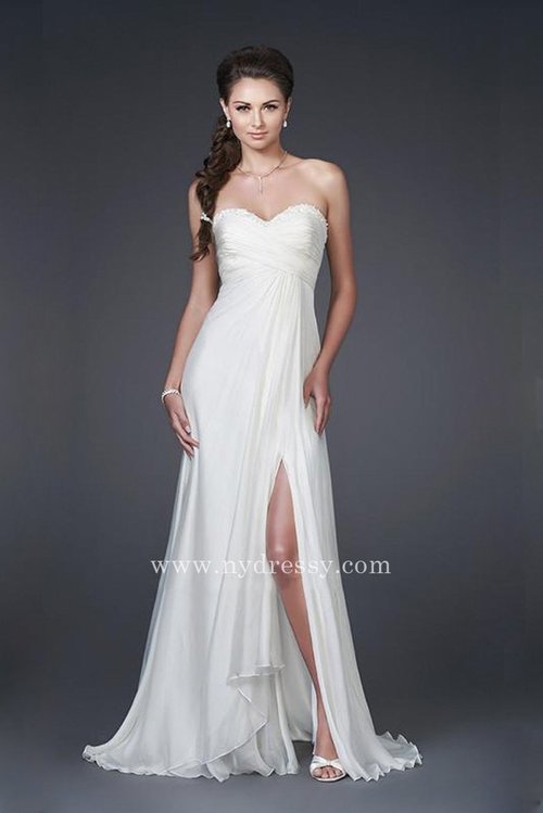  Feel sensuous in this stretch satin strapless bridal gown by La Femme 15100. The sweetheart neckline features wrapped, sheer fabric with eye-catching jewel detail that continues around to the moderate cut back. Rouched bodice that features a beaded sweetheart neckline. Drape skirt creates soft pleats and there is an optional slit.
 
Closure: Side Zipper
Details: Jewel Neckline, High Leg Slit
Fabric: Stretch Satin
Length: Floor Length
Neckline: Strapless
Waist: Natural